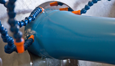 Pipe being cooled during extrusion